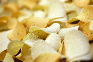 Many orange Pringles potato snack chips. Pringles is a brand of potato snack chips owned by Kellogg Company photo