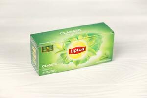 KHARKOV, UKRAINE - DECEMBER 8, 2020 Lipton classic green tea bags. Lipton is a British brand of tea owned by Unilever and PepsiCo photo