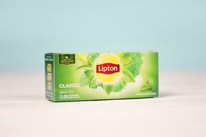 KHARKOV, UKRAINE - DECEMBER 8, 2020 Lipton classic green tea bags. Lipton is a British brand of tea owned by Unilever and PepsiCo photo