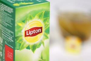 KHARKOV, UKRAINE - DECEMBER 8, 2020 Lipton classic green tea bags. Lipton is a British brand of tea owned by Unilever and PepsiCo photo