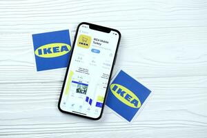 KHARKOV, UKRAINE - MARCH 5, 2021 Ikea icon and application from App store on iPhone 12 pro display screen on white table photo