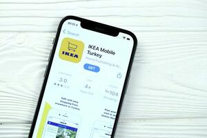 KHARKOV, UKRAINE - MARCH 5, 2021 Ikea icon and application from App store on iPhone 12 pro display screen on white table photo