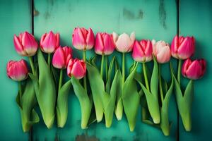 Frame of tulips on turquoise rustic wooden background. Spring flowers. Neural network AI generated photo