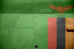 Zambia flag depicted on side part of military armored helicopter closeup. Army forces aircraft conceptual background photo