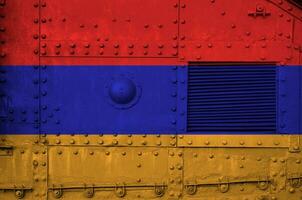 Armenia flag depicted on side part of military armored tank closeup. Army forces conceptual background photo