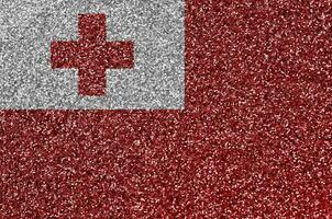 Tonga flag depicted on many small shiny sequins. Colorful festival background for party photo