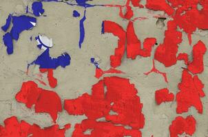 Taiwan flag depicted in paint colors on old obsolete messy concrete wall closeup. Textured banner on rough background photo