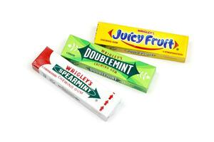 KHARKOV, UKRAINE - FEBRUARY 14, 2021 Wrigleys Spearmint Doublemint and Juicy Fruit chewing gum in classic design photo