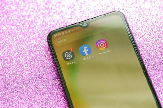 KYIV, UKRAINE - JULY 7, 2023 Threads by Meta application on display of Samsung smartphone lying on table photo