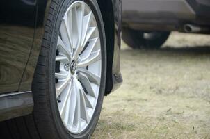 Toyota corolla wheel with bridgestone turanza tires and aluminium rims photo