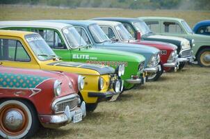 Row of renovated Moskvich and Gaz Volga Retro Cars from the USSR times photo