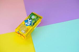 Tuc snack pack on bright multi colored flat background photo