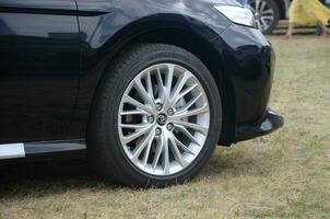 Toyota corolla wheel with bridgestone turanza tires and aluminium rims photo