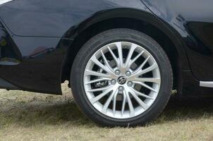 Toyota corolla wheel with bridgestone turanza tires and aluminium rims photo