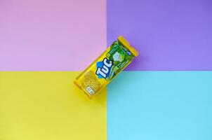 Tuc snack pack on bright multi colored flat background photo