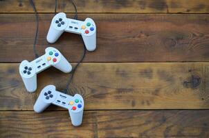 Dendy video game console classic controllers on a wooden table photo