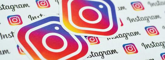 Instagram pattern printed on paper with small instagram logos and inscriptions. Instagram is American photo and video-sharing social networking service owned by Facebook