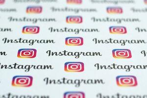 Instagram pattern printed on paper with small instagram logos and inscriptions. Instagram is American photo and video-sharing social networking service owned by Facebook