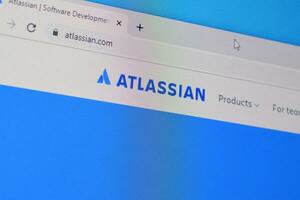 Homepage of atlassian website on the display of PC, url - atlassian.com. photo