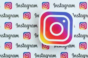 Instagram pattern printed on paper with small instagram logos and inscriptions. Instagram is American photo and video-sharing social networking service owned by Facebook