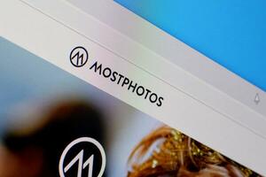 Homepage of mostphotos website on the display of PC, url - mostphotos.com. photo