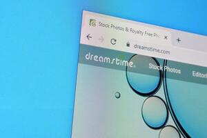 Homepage of dreamstime website on the display of PC, url - dreamstime.com. photo