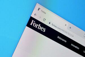 Homepage of forbes website on the display of PC, url - forbes.com. photo