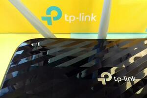 Wireless router modem tp link Archer C20 AC750 and colored cardboard box with tp-link logo photo