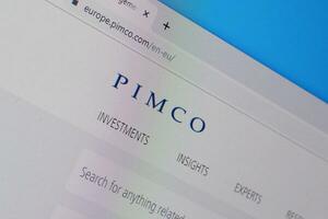 Homepage of pimco website on the display of PC, url - pimco.com. photo