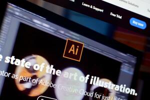 Web page of adobe illustrator product on official website on the display of PC photo