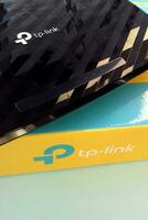 Wireless router modem tp link Archer C20 AC750 and colored cardboard box with tp-link logo photo