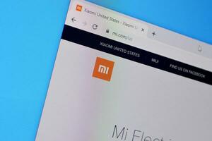 Homepage of xiaomi website on the display of PC, url - mi.com. photo