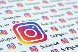 Instagram pattern printed on paper with small instagram logos and inscriptions. Instagram is American photo and video-sharing social networking service owned by Facebook