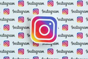 Instagram pattern printed on paper with small instagram logos and inscriptions. Instagram is American photo and video-sharing social networking service owned by Facebook