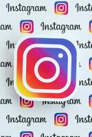 Instagram pattern printed on paper with small instagram logos and inscriptions. Instagram is American photo and video-sharing social networking service owned by Facebook