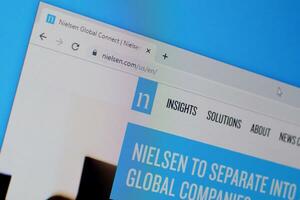 Homepage of nielsen website on the display of PC, url - nielsen.com. photo