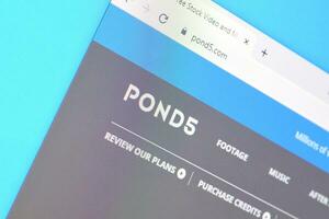 Homepage of pond5 website on the display of PC, url - pond5.com. photo