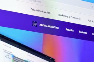 Web page of adobe analytics product on official website on the display of PC photo