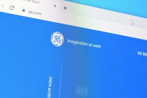 Homepage of ge t and d website on the display of PC, url - ge.com. photo