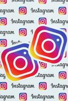 Instagram pattern printed on paper with small instagram logos and inscriptions. Instagram is American photo and video-sharing social networking service owned by Facebook