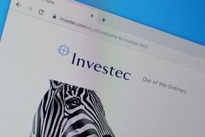 Homepage of investec website on the display of PC, url - investec.com. photo
