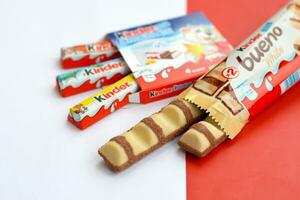 Kinder Chocolate small box for kids and bueno white chocolate bar made by Ferrero SpA. Kinder is a confectionery product brand line of multinational manufacturer Ferrero photo