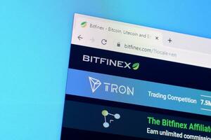 Homepage of bitfinex website on the display of PC, url - bitfinex.com. photo