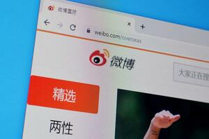 Homepage of weibo website on the display of PC, url - weibo.com. photo