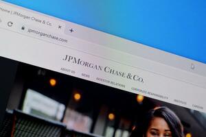 Homepage of jp morgan chase website on the display of PC, url - jpmorganchase.com. photo
