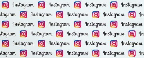 Instagram pattern printed on paper with small instagram logos and inscriptions. Instagram is American photo and video-sharing social networking service owned by Facebook