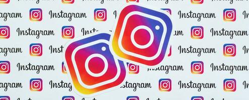 Instagram pattern printed on paper with small instagram logos and inscriptions. Instagram is American photo and video-sharing social networking service owned by Facebook