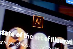 Web page of adobe illustrator product on official website on the display of PC photo