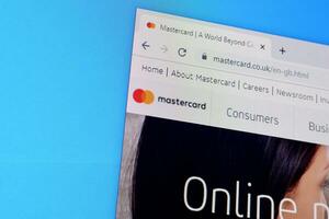 Homepage of mastercard website on the display of PC, url - mastercard.com. photo