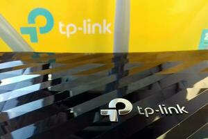 Wireless router modem tp link Archer C20 AC750 and colored cardboard box with tp-link logo photo